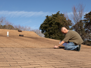 A residential roof being inspected by an Easton roofing contractor.
